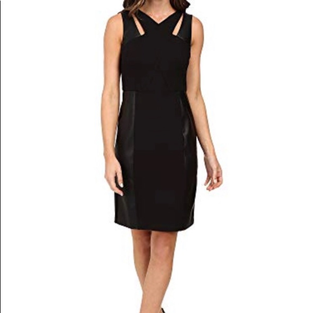 LBD with leather paneling and cross cross accents